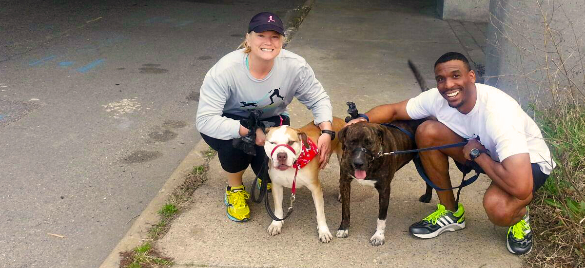Running Buddies volunteers Janice Akers and Stephen Carter with dogs Lenora and Snoopy